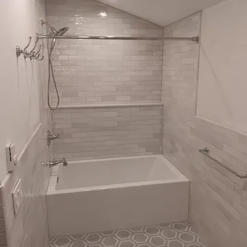 Custom tile walk-in shower and bathtub from a Leelanau County bathroom remodeling project