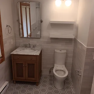 Custom bathroom vanity, shelving, and tilework completed in Leelanau County, Michigan