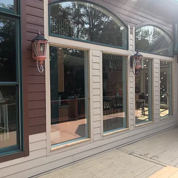 Custom deck remodel with new windows, trim, and painting in Lake Leelanau, Michigan