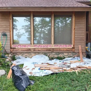 Early stage of an exterior home restoration project in Leelanau County, Michigan