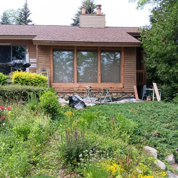 Restored exterior trim, siding, and window inlay from a Lake Leelanau home remodel